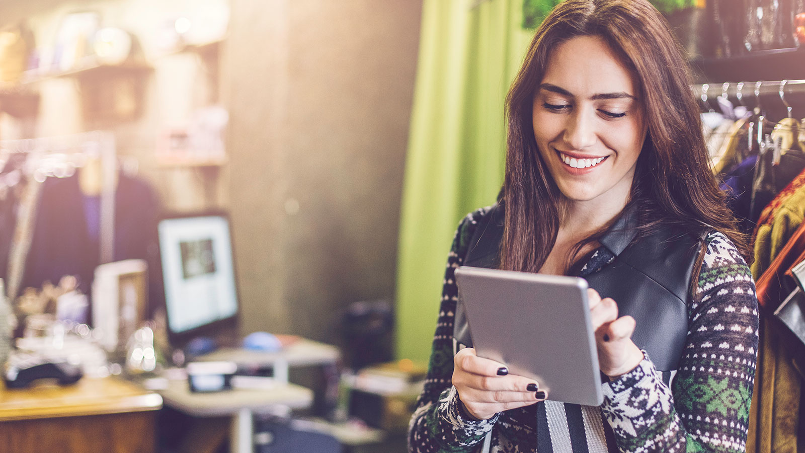 Business owner browsing apps on tablet